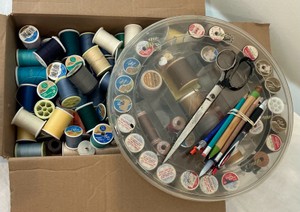 Various spools of thread, misc sewing notions