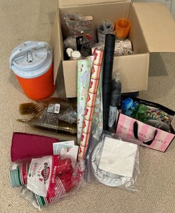 Various paper plates, plastic cups, party supplies
