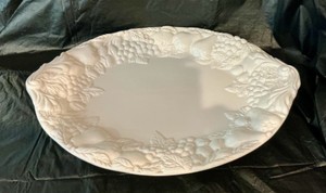 White porcelain serving tray with embossed fruit