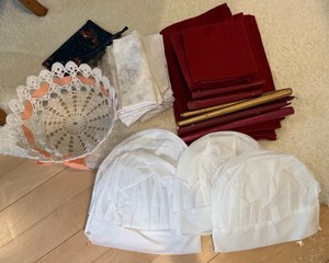 Group of placemats, napkins, candles, chef hats misc
