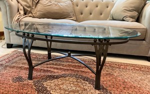 Wrought iron oval coffee table with beveled glass top