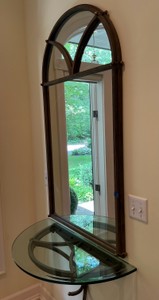 Ornate arched entryway mirror with matching wall console
