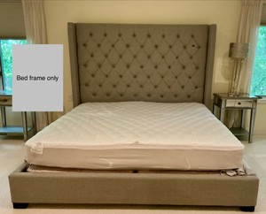 King sized light grey, button tufted wingback bed, upholstered headboard, low profile frame