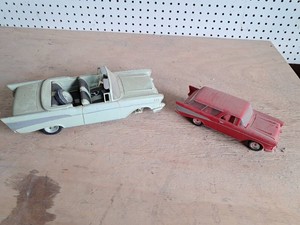 2 Model Cars  1 missing wheel but in the seat