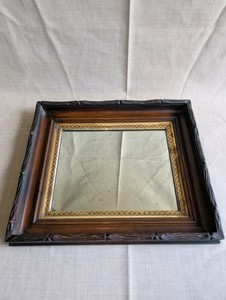 Antique Victorian Eastlake shadow box frame mirror,dark walnut wood exterior and an ornate gold gilt trim