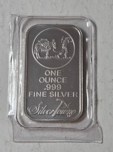 1 Troy Oz. .999 fine silver bar featuring the signature Prospector and Donkey design from Silver Towne