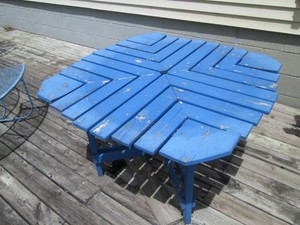 Blue wood outdoor table with center...