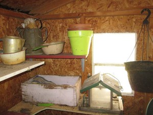 Metal pitchers and pans, hanging wo...