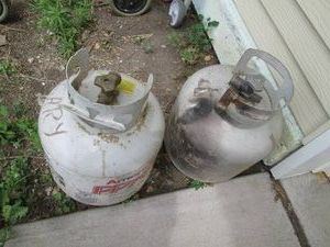 (2) 20lb propane cylinders One em...