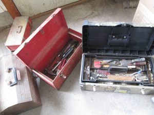 Bundle of empty metal toolboxes in ...