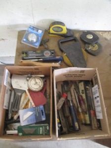 Variety of tape measures, levels, c...