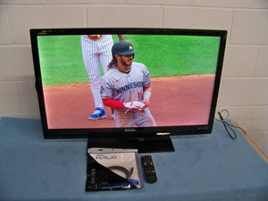 Sharp TV on Stand with Remote Control and HDMI Cable