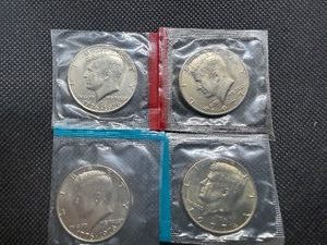 Four Kennedy Half Dollars Cut from Mint Package