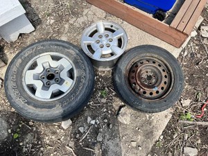 Lot of 3 Wheels and Tires Including Bridgestone Dueler HP 23565R on 5-Lug Alloy Wheel, Laufenn G Fit 19560R15 on Steel Rim, and Dodge Rim