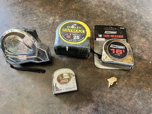 Multiple tape measures from brands including Stanley and Tool Shed, sizes range from 10 to 25.