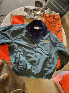 Cabelas Outerwear Jacket XXL, Bushmaster Hunting Vest XL, and Orange Camouflage Pants XL