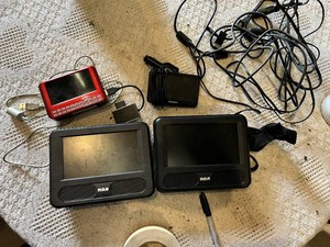 Lot of Electronics and Accessories including RCA Portable DVD Player Monitors, Garmin GPS, and Red Media Player with Cables