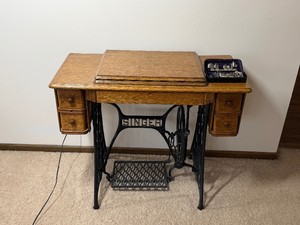Vintage Singer Treadle Sewing Machine with Cast Iron Base and Wood CasingBRING HELP TO LOAD