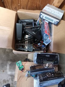 Box of car stereos and electronics