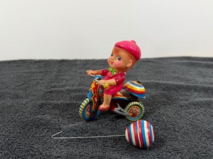 vintage Japanese wind-up tin and celluloid toy typically known as the Suzuki Bell Cycle or Boy on Tricycle
