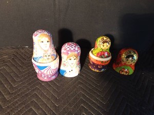2 Hand-painted Russian nesting dolls featuring cat lady design