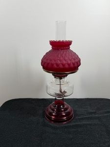 Vintage kerosene lamp features a distinctive quilted diamond pattern on the shade, with similar models produced in the 1930s and 1940s