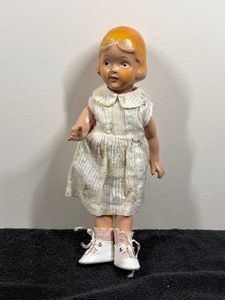 vintage 1920s to 1930s composition doll, heavily designed in the classic Patsy Ann style popularized by companies like Effanbee and Arranbee.