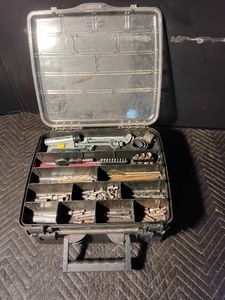 Rubbermaid toolbox full of bits and black & decker battery operated power tools with batteries and battery chargers