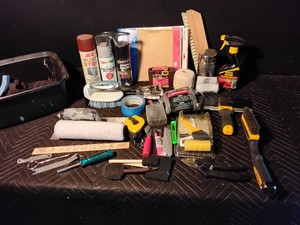 Tub of painting supplies, spray paint and more