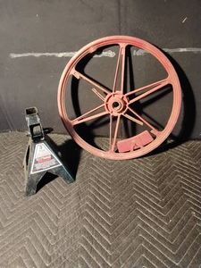 Craftsman 3 Ton metal jack stand and a metal wheel