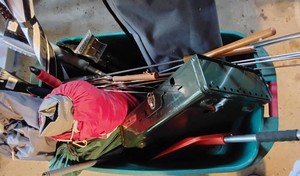 Large tote of camping gear and snow scrapers