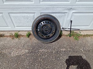 Spare Donut tire and 3 way tire iron