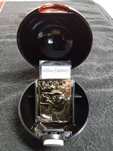 Pokemon 23k gold plated Pikachu card in a Poke Ball case with certificate of authenticity