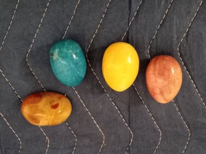 3 Stone eggs and a polished agate