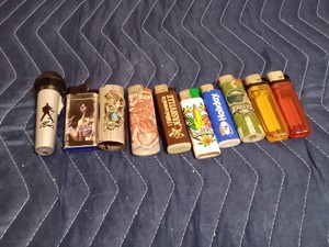 Lot of disposable lighters and 1 case