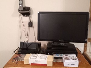 Phillips TV, Sony wireless receiver, Panasonic cordless home phone, X Sense smoke alarm, and Co & smoke smoke alarm