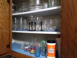 All Glassware inside cupboard (must take all and bring boxes to pack)