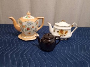 Vintage Teapot and matching trivet and 2 other teapots