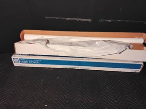 1 roll and a partial roll of white polyethylene table cover
