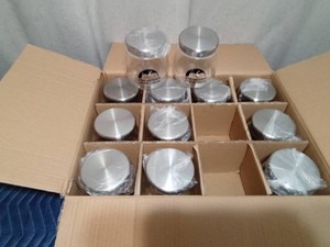 Box of advertised jars with metal