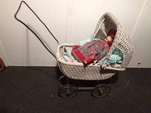 Doll wicker baby buggy with porcelain doll and Afghan