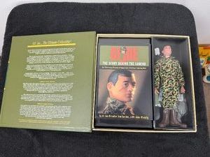 G.I. Joe Action Marine Masterpiece Edition (Volume III). Released by Hasbro in 1996, this special collectors box set features a 1964 reproduction action figure alongside a deluxe hardcover history book titled The Story Behind The Legend.