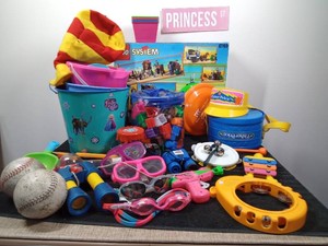 Musical, beach and sports toys and an empty Lego box