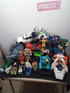 Lot of toy vehicles and characters