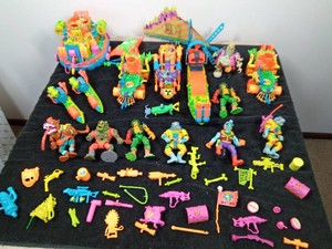 A collection of Vintage 1990s Playmates Toxic Crusaders vehicles and character figures