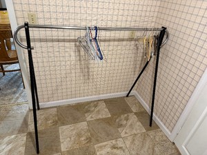 single-rail commercial garment rack With hangers