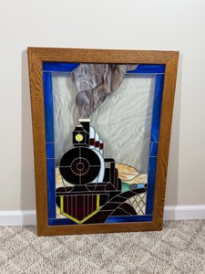 handcrafted stained glass window panel depicting a vintage steam locomotive