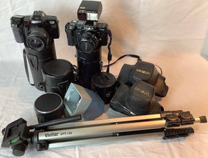 Minolta Cameras and Lens Lot with Tripod - Maxxum7000i, Maxxum 7000 with Flash, 50 mm lens with case, 35-200mm lens, 28-135mm lens with case,100-300m lens with case, Argus Pre-Viewer, Vivitar Tripod with level