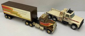 Two Vintage Nylint Pressed Steel Trucks Including Firestone Semi (Missing Pin For Trailer Hook Up) 25 And Nylint Racing Team Tow Truck (missing Tow Hook) 15