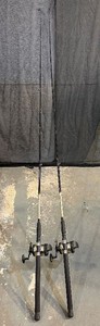 Two Fishing Rods and Reels Daiwa Black Widow Rods 1B4862MC-D 86 with Shakespeare Tidewater 30 LCL Reels